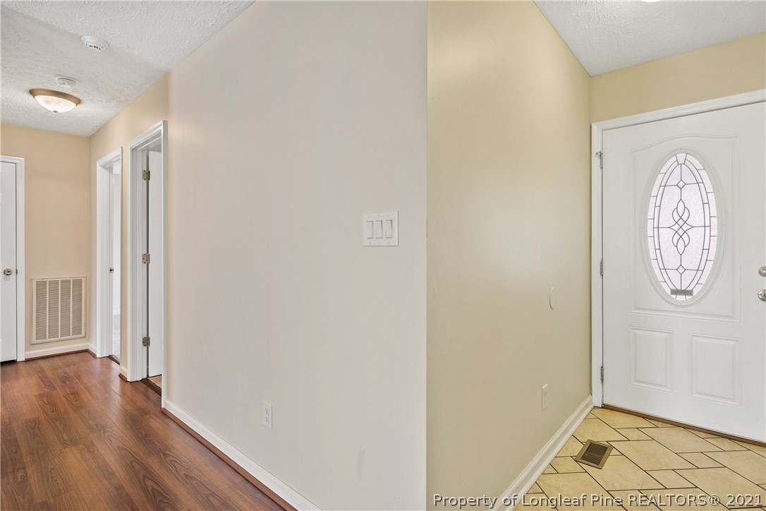 6568 Applewhite Road Fayetteville, NC 28304 - Photo 6 of 46 a view of room with wooden floor