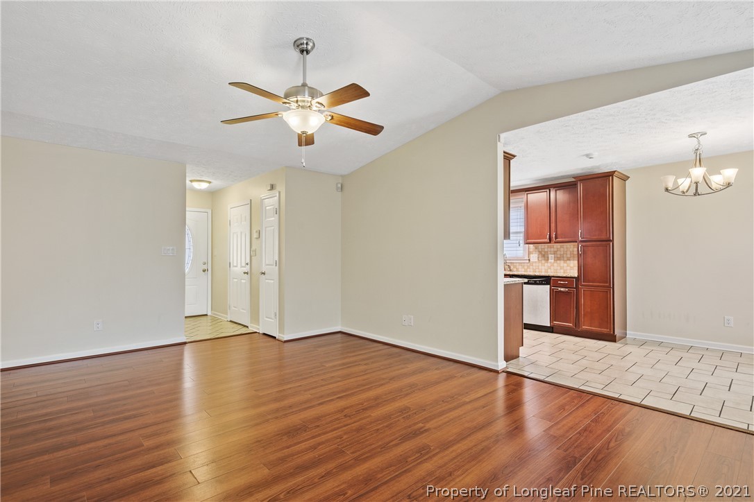6568 Applewhite Road Fayetteville, NC 28304 - Photo 10 of 46 a view of an empty room with wooden floor