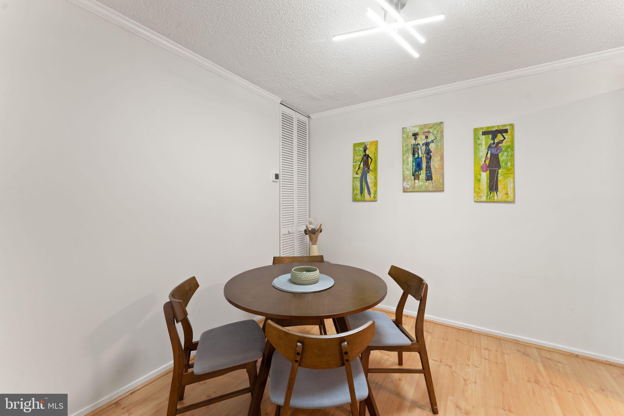 11741 Summerchase Circle, Unit A Reston, VA 20194 - Photo 15 of 32 a table and chairs in a room