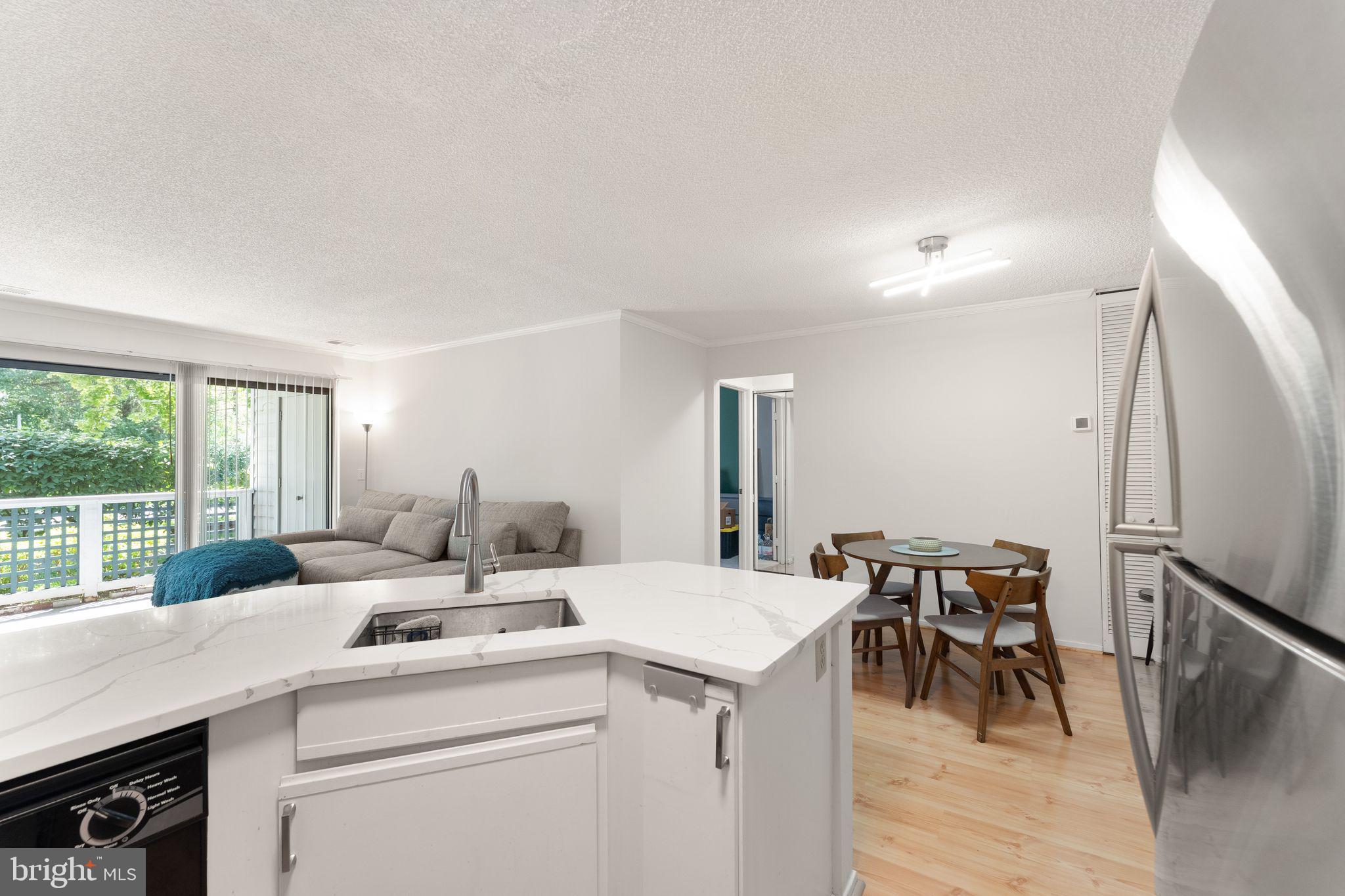 11741 Summerchase Circle, Unit A Reston, VA 20194 - Photo 20 of 32 a view of dining table chairs and window