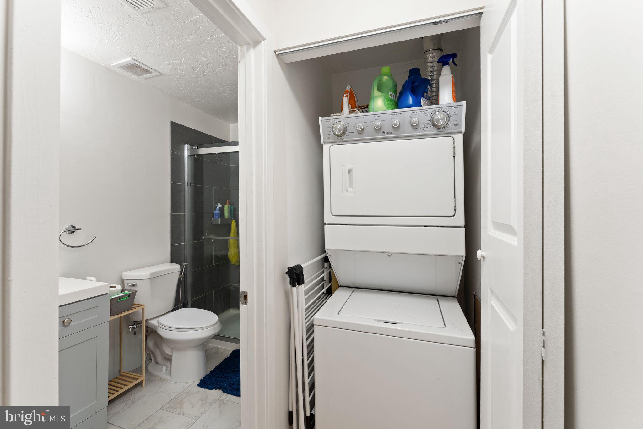 11741 Summerchase Circle, Unit A Reston, VA 20194 - Photo 25 of 32 a room with a washer and dryer