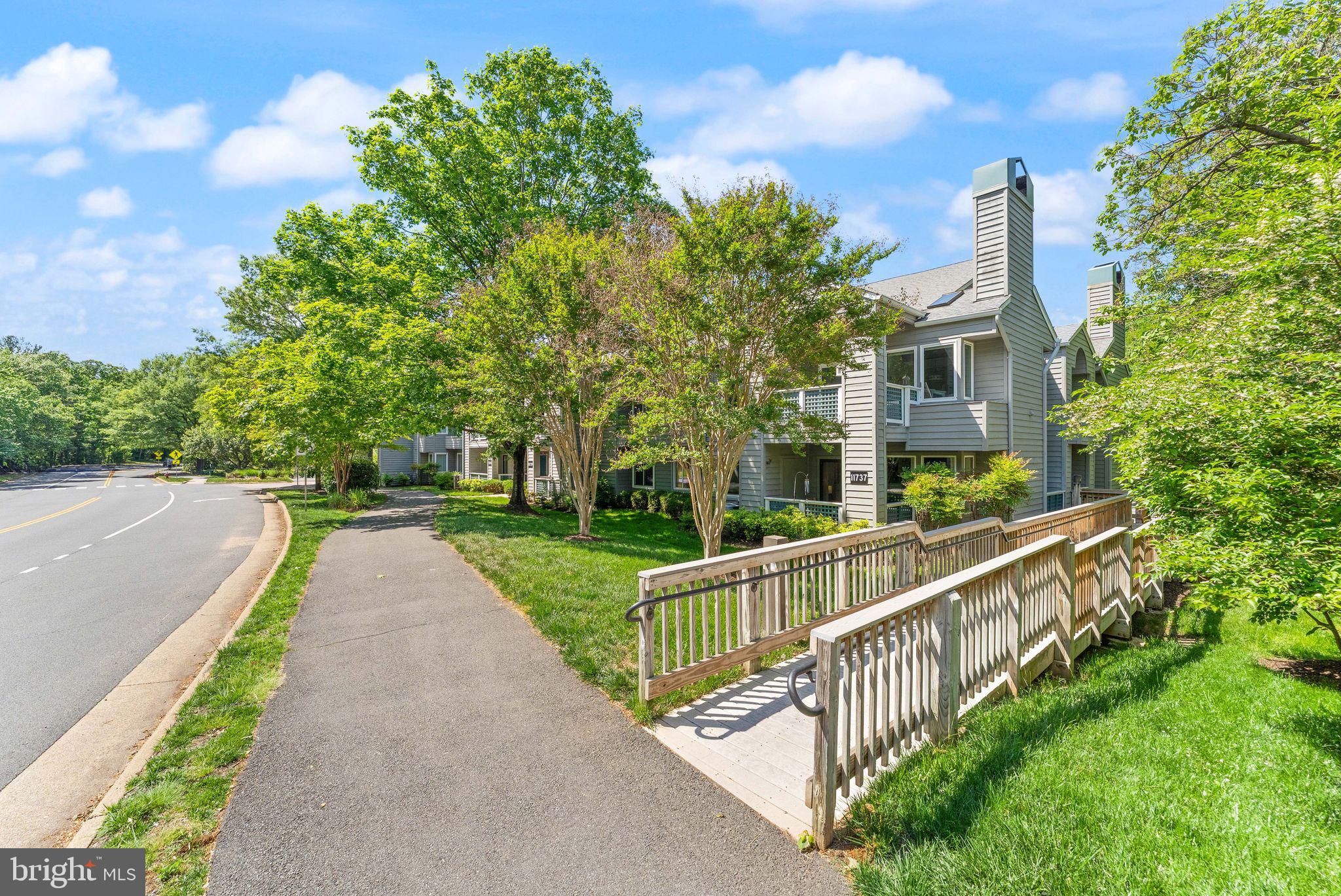 11741 Summerchase Circle, Unit A Reston, VA 20194 - Photo 28 of 32 a view of a house with backyard and trees