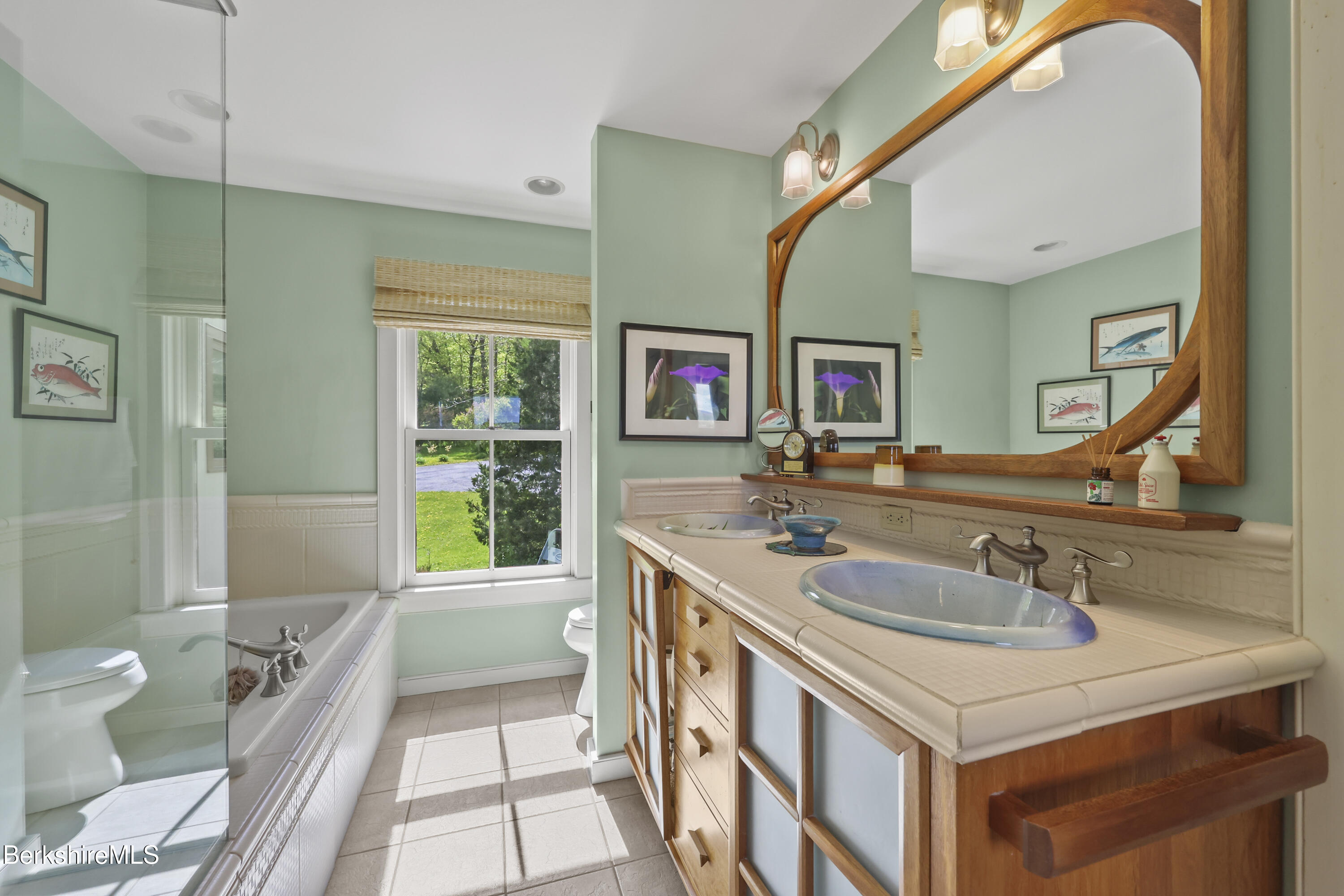 821 Pattison Road North Adams, MA 01247 - Photo 36 of 68 a bathroom with a sink a toilet a mirror and vanity