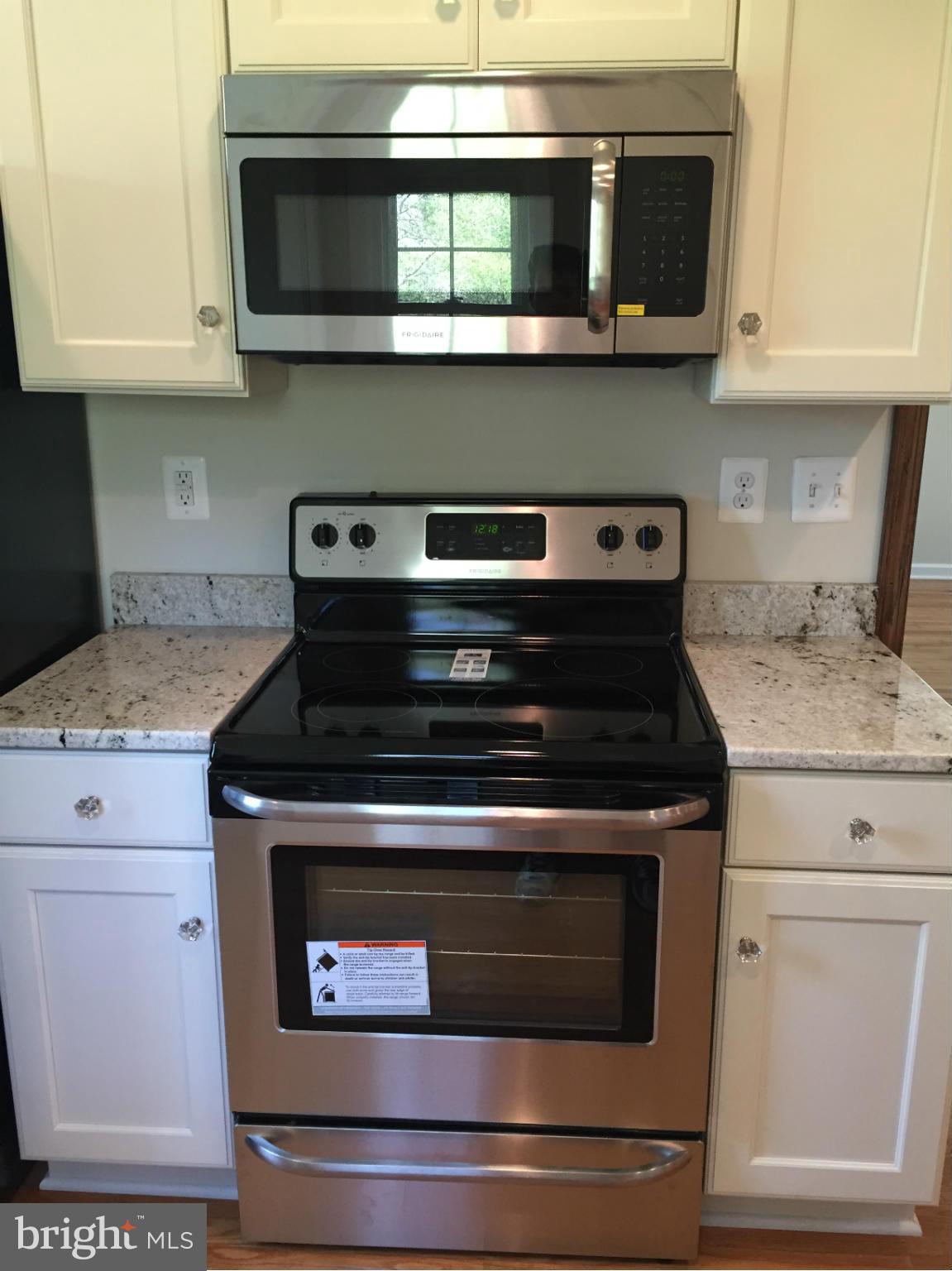 8227 Buckland Mill Road Gainesville, VA 20155 - Photo 13 of 30 New Cabinets, Stainless Microwave and Range