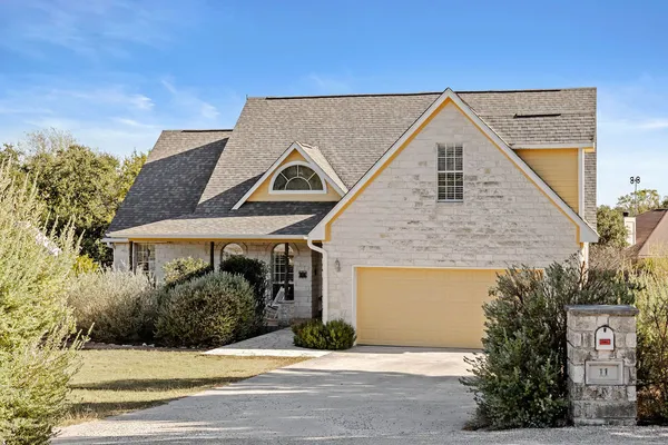 a front view of a house with yard