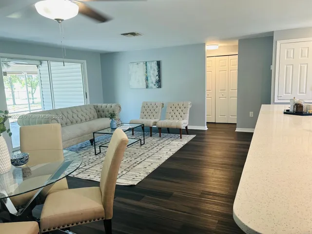 a large bedroom with a bed and window