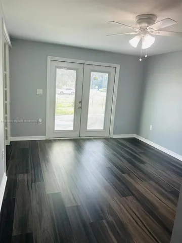 a bathroom with a shower and a sink