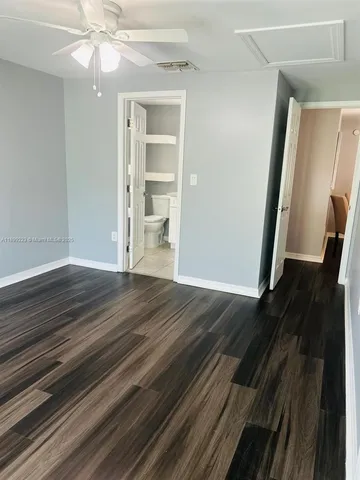 a bathroom with a toilet a sink and a window