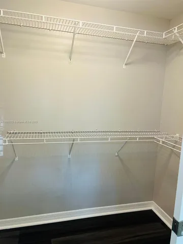 a view of room with window and ceiling fan