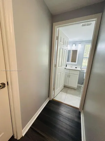 a living room with a bed and a fireplace