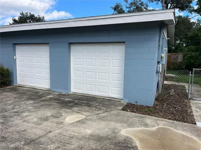 a view of a park with large trees