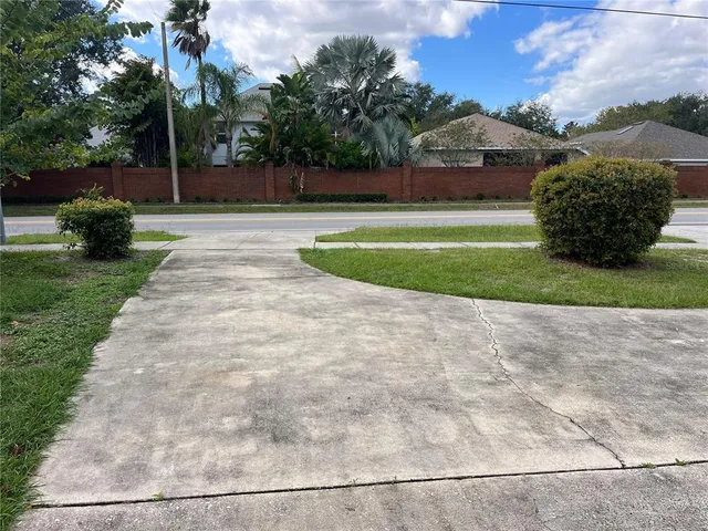 a front view of a house with a yard and a garage