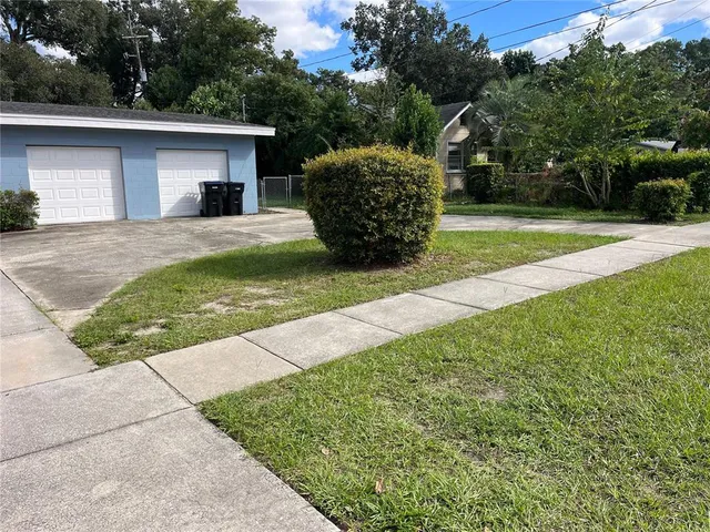 a house view with a garden space