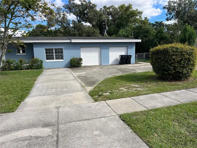 a view of a house with a yard
