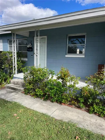 a kitchen with stainless steel appliances a stove a sink and a microwave