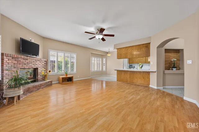 a view of an empty room with a fireplace