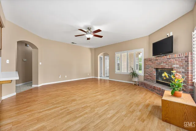 a view of livingroom with hardwood floor and a ceiling fan