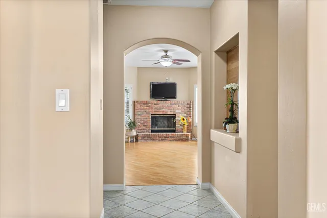 a spacious bedroom with a bed dresser and a window