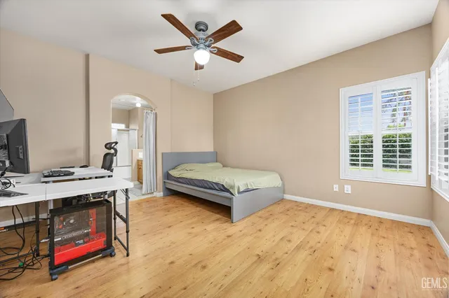 a bed room with a bed and a chair