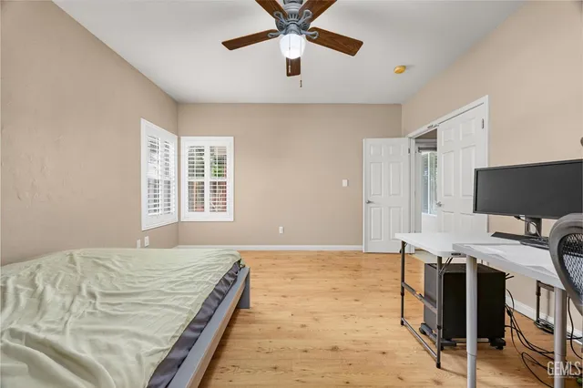 a spacious bathroom with a double vanity sink and a mirror