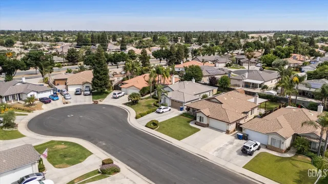 an aerial view of a house with outdoor space