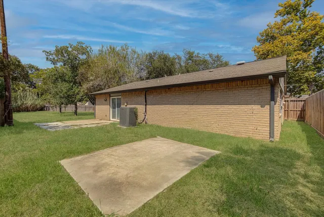 a view of a backyard with a garden