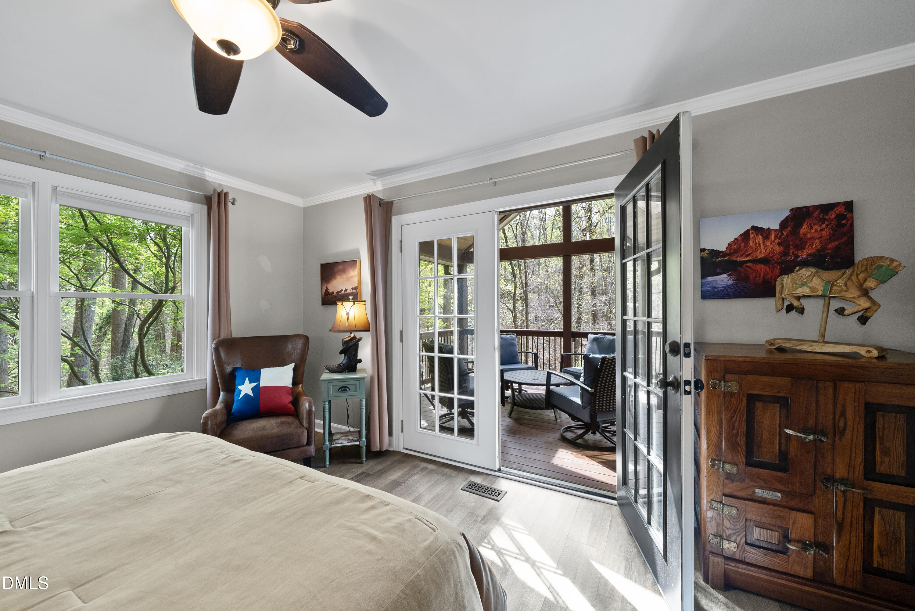 6200 Splitrock Trail Apex, NC 27539 - Photo 16 of 64 a bedroom with a bed gym equipment and a large window