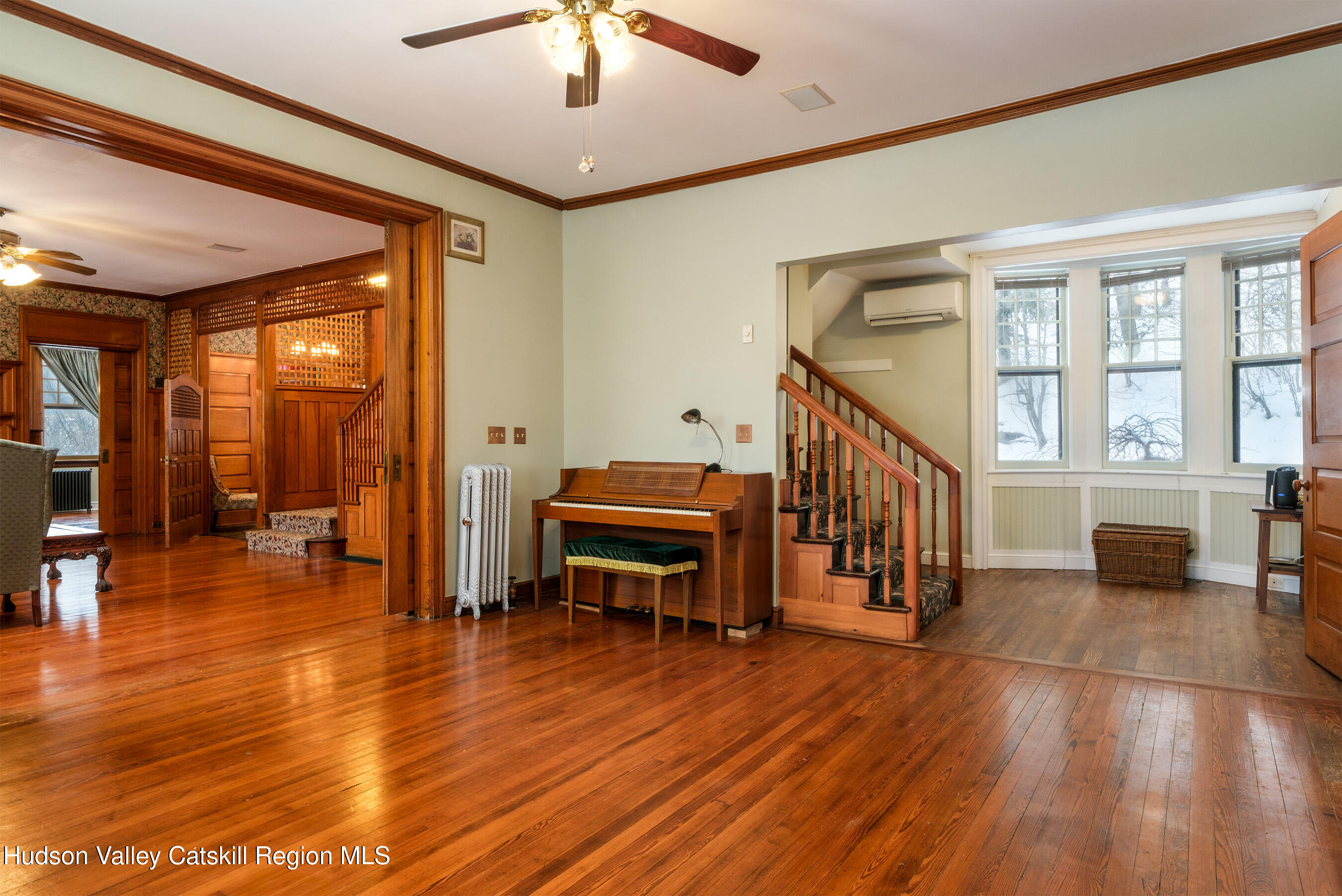 6 Westridge Road Cooperstown, NY 13326 - Photo 44 of 119 a view of a livingroom with furniture a dinning room and wooden floor