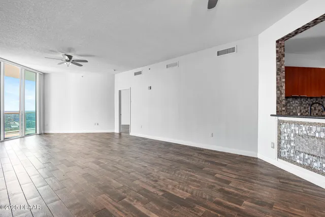 a dining room with furniture a window and a kitchen view