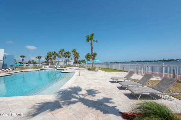 a view of a swimming pool and an outdoor space
