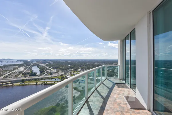 a view of balcony with furniture