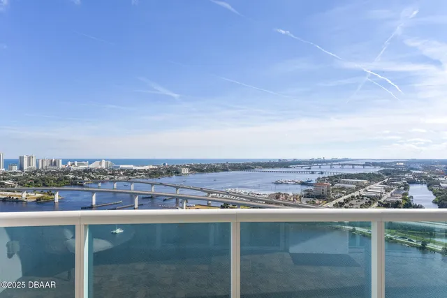 a kitchen with stainless steel appliances granite countertop wooden cabinets and a counter top space