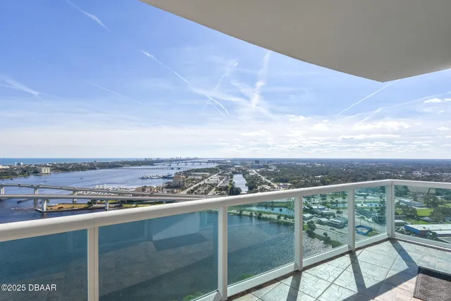 a kitchen with stainless steel appliances granite countertop a stove a microwave and a sink