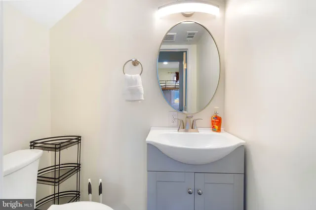 a bathroom with a sink and mirror