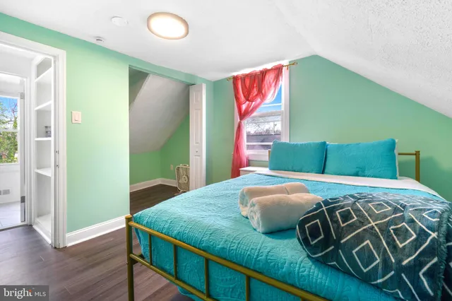 a bedroom with a bed and a dresser