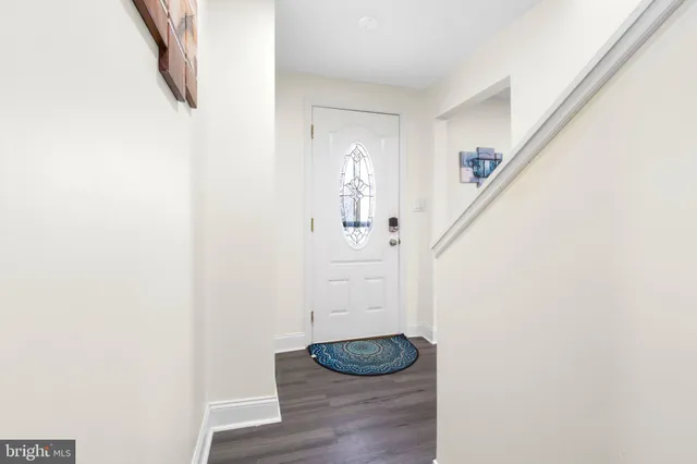 a view of a hallway with front door