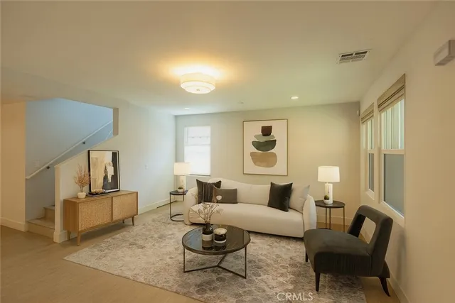 a living room with furniture and a window