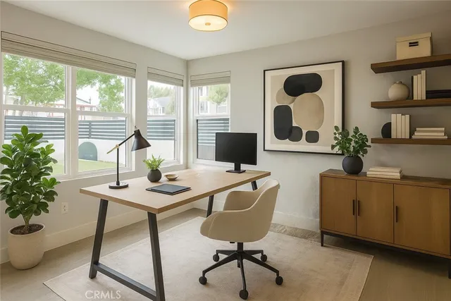 a living room with furniture and potted plant