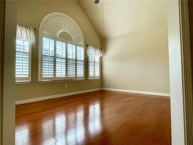 a kitchen with stainless steel appliances kitchen island granite countertop a stove a sink and a refrigerator