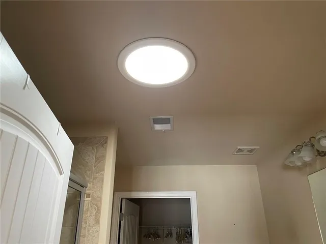 a view of a house with a yard and deck