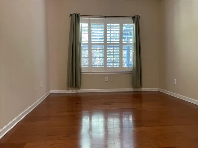 a view of a house with swimming pool and sitting area