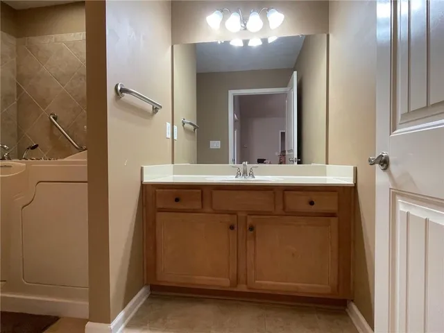 a view of a chairs and table in the backyard
