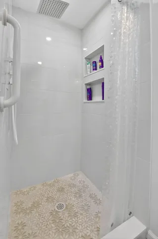 a bathroom with a shower and a toilet