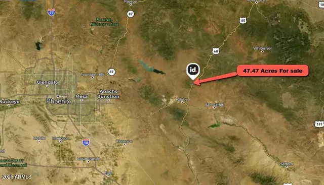 a view of a road with a snow in the background