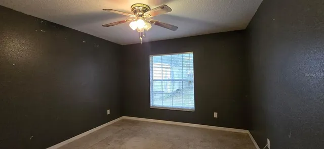 wooden floor and window in an empty room
