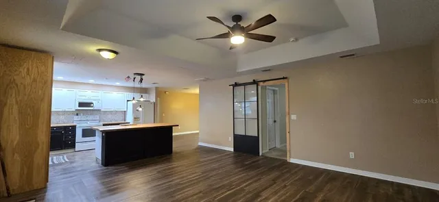 a view of kitchen with sink and wooden floor