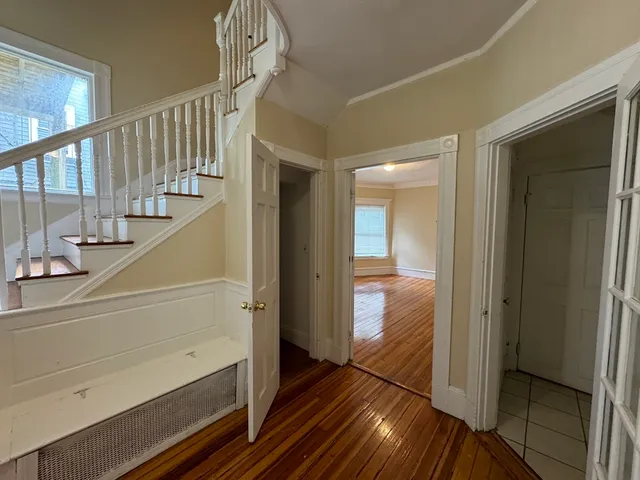 a view of staircase with wooden floor and staircase