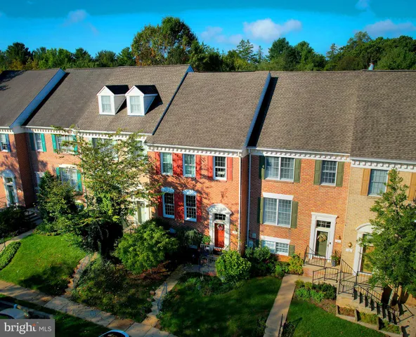 an aerial view of house with yard and ocean view
