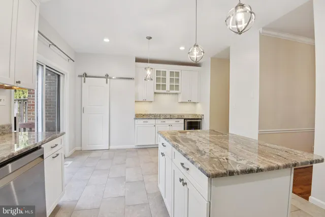 a kitchen with cabinets and window