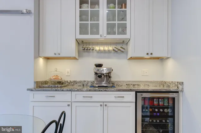 a kitchen with stainless steel appliances granite countertop a sink and cabinets